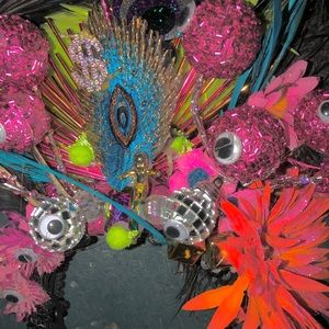 Eye popping costume feather head dress.